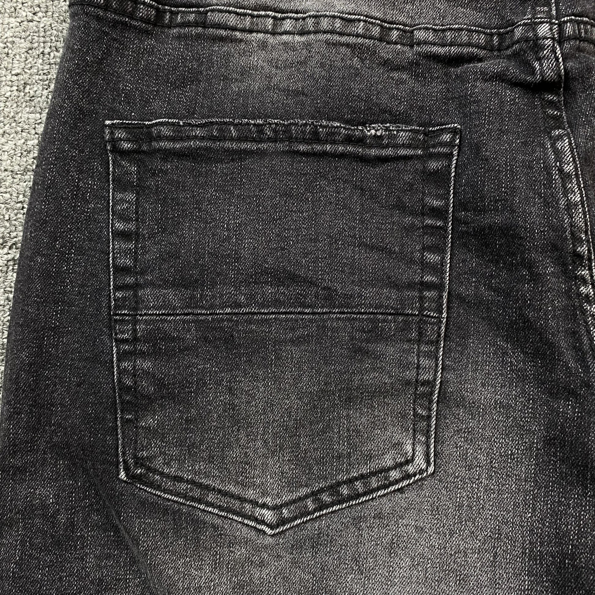 AMIRI VARSITY LOGO REPAIR JEANS