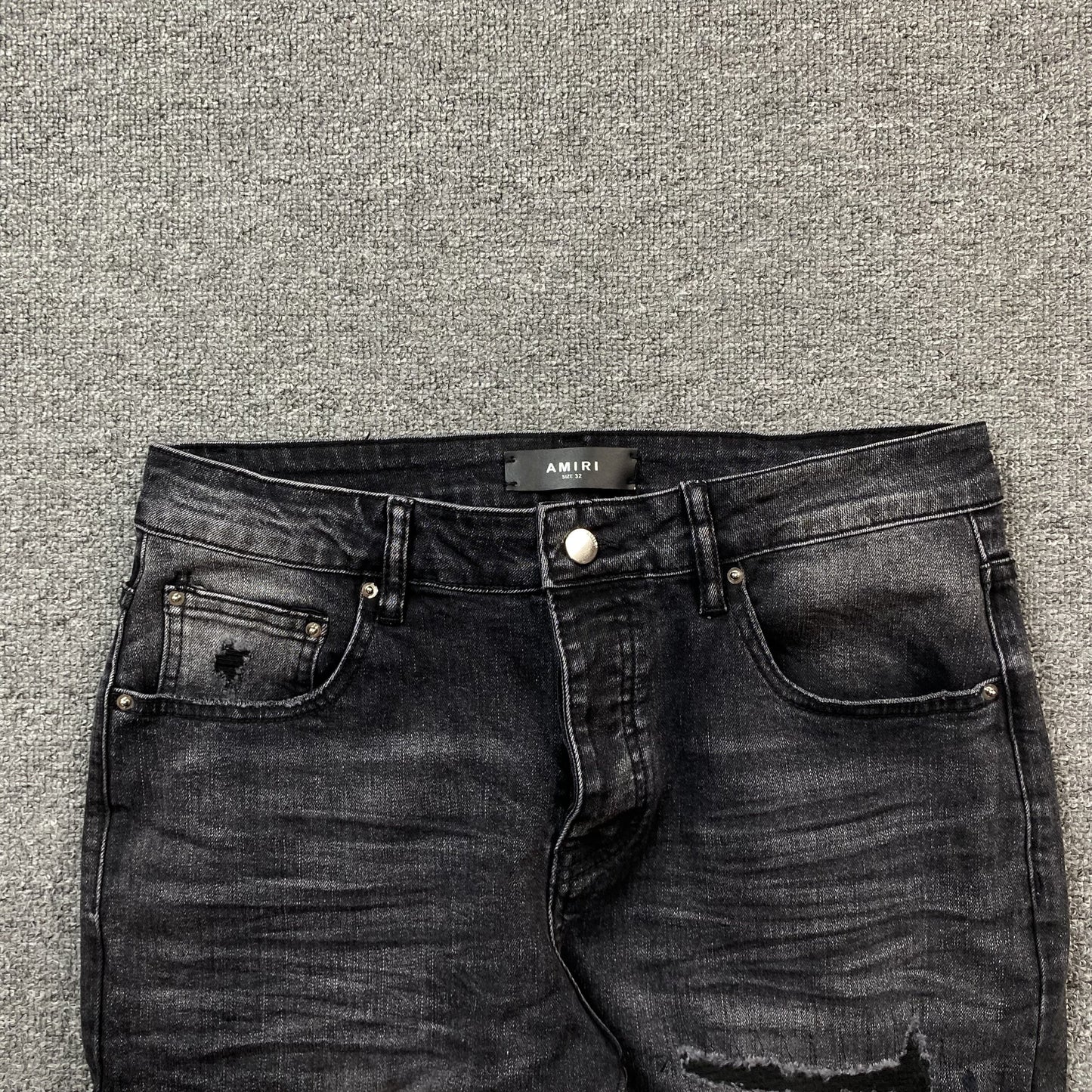 AMIRI VARSITY LOGO REPAIR JEANS